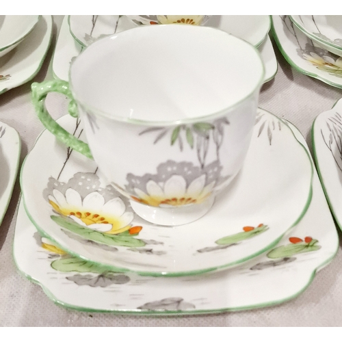 407 - Roslyn 20 pieces Bone China Tea Set. 6 Trios, Milk Jug and Sugar Bowl