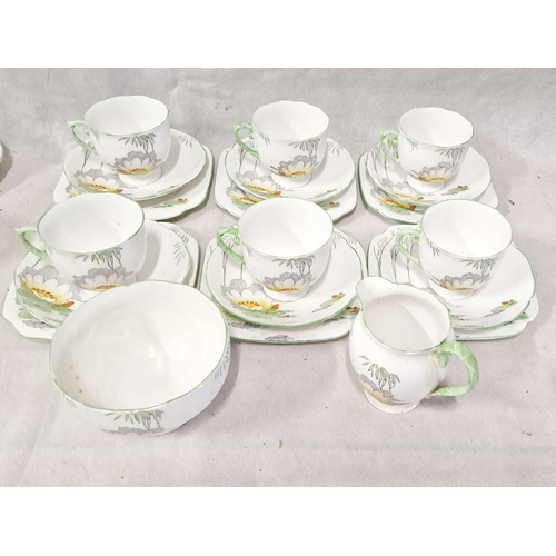 407 - Roslyn 20 pieces Bone China Tea Set. 6 Trios, Milk Jug and Sugar Bowl