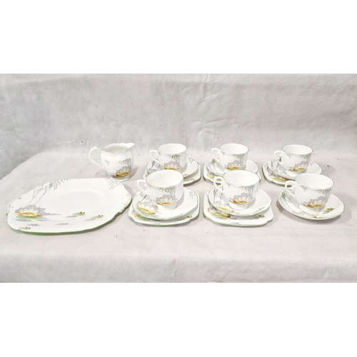 421 - Roslyn Bone China Lily Pattern 19 Pieces, 5 Trios, 1 Duo, Milk Jug and Sandwich Plate.