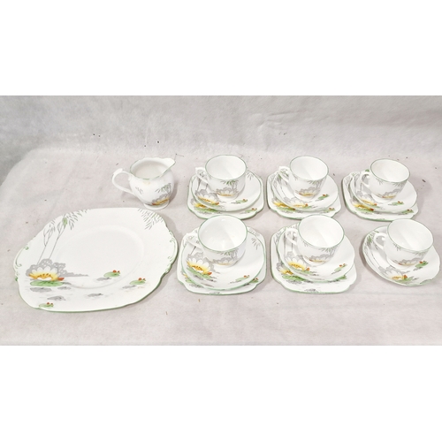 421 - Roslyn Bone China Lily Pattern 19 Pieces, 5 Trios, 1 Duo, Milk Jug and Sandwich Plate.