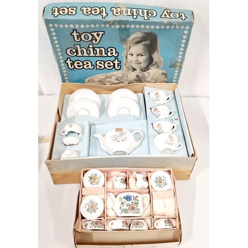 525 - Two Childs Tea Sets In Original Boxes. One Saucer in The Largerc Set has a Small Chip.