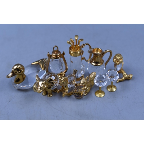 254 - Selection of Swarovski Crystal Gold Tone Miniature Figures including Golf Clubs, Duck, Elephant and ... 