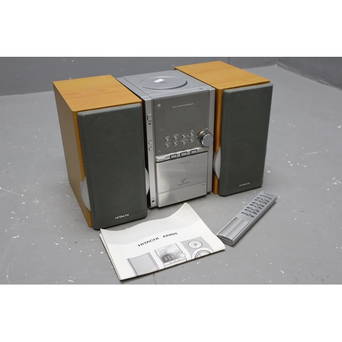 618 - Hitachi AX-M80 CD Tape Cassette Radio complete with speakers and remote. Powers on when tested