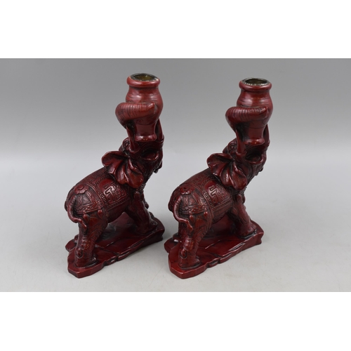 326 - A Pair of Oriental Red Resin Elephant Candleholders, Both Approx 8” Tall. One Has Chipped Ear