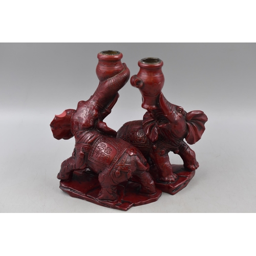 326 - A Pair of Oriental Red Resin Elephant Candleholders, Both Approx 8” Tall. One Has Chipped Ear