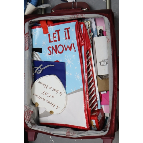 927 - Three Suitcases to include various items. Includes Approx. 25 Gift Bags, Christmas items, Cordless P... 