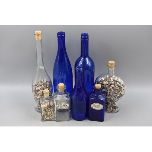 835 - Four Blue Glass Bottles including Aloe Vera and Four Shell Filled Decorative Bottles (Tallest 12