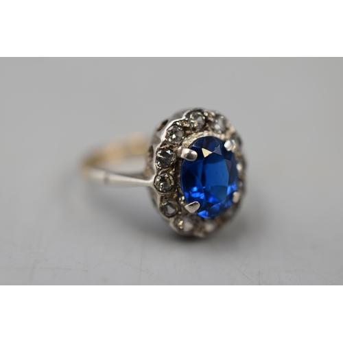 10 - A 9ct Gold and 925. Silver Blue and Clear Stoned Ring, Size K