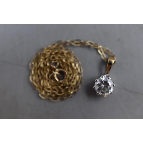 11 - A 9ct Gold Clear Stone Pendant, on 9ct Gold Chain