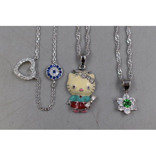 15 - Three Silver 925 Necklaces to include Hello Kitty Style, Flower with Green Stone and Diamanté... 