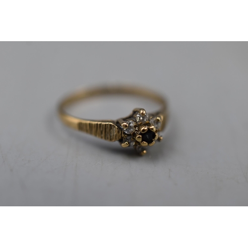 24 - A 9ct Gold Clear and Sapphire Stoned Ring, Size I