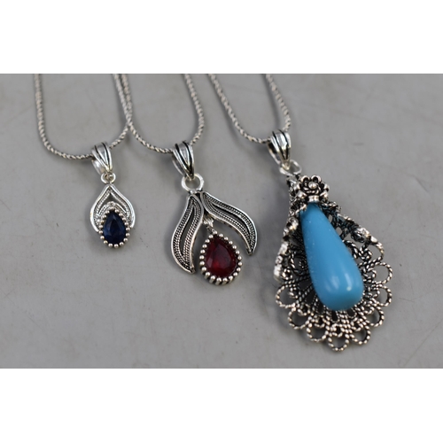 60 - Three Silver 925 Pendant Necklaces on Silver 925 Chains. Includes Floral Blue Stone Design and Red a... 