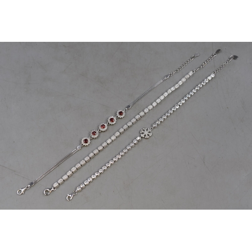 74 - Three Silver 925 Diamanté Bracelets to include Red Stone Design and Snowflake Design