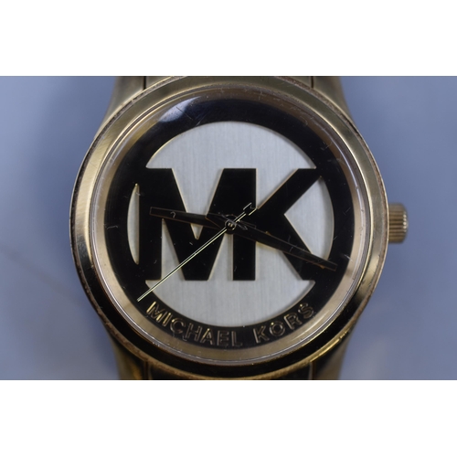 81 - A Gold Tone Michael Kors Watch, Working