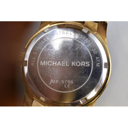 81 - A Gold Tone Michael Kors Watch, Working