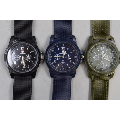 107 - Three gents military style watches with woven straps in black, blue and green new and unused