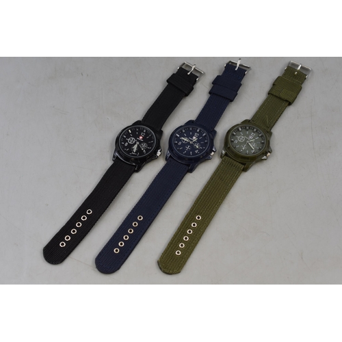 107 - Three gents military style watches with woven straps in black, blue and green new and unused