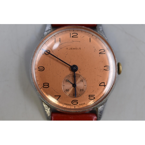 113 - A Swiss 7 Jewels Mechanical Watch With Red Leather Strap. Working