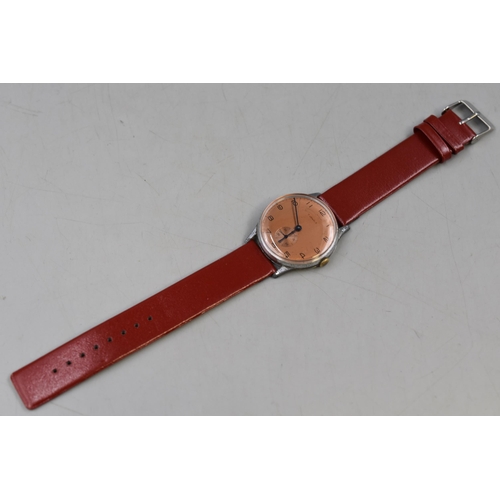 113 - A Swiss 7 Jewels Mechanical Watch With Red Leather Strap. Working