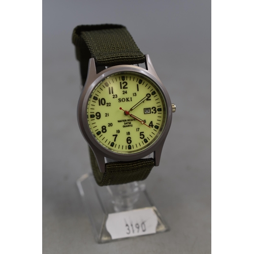 136 - Gents military style watch with green webbing strap new on stand