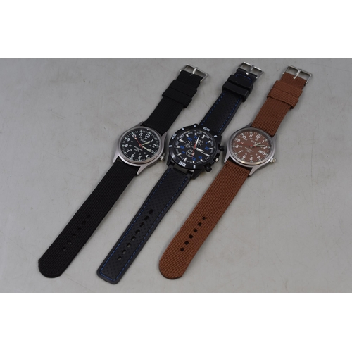 139 - Three gents watches two black and one brown, new and unused