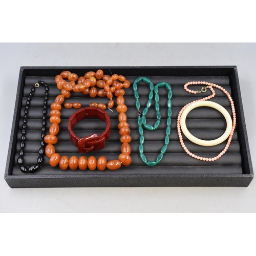 152 - Mixed Selection of Jewellery items to include Two Bangles and a Selection of Necklaces