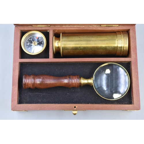 299 - A Three Piece Travellers Set In Wooden Case. Includes Compass, Telescope and Magnifying Glass