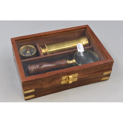 299 - A Three Piece Travellers Set In Wooden Case. Includes Compass, Telescope and Magnifying Glass