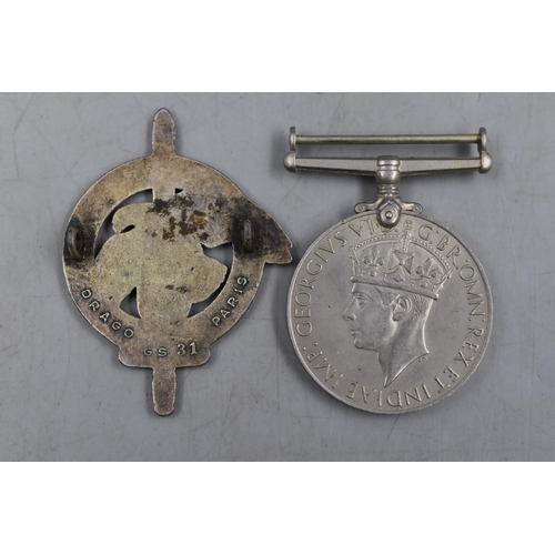 303 - Two Military Badges To Include 1939-45 Medal, And French Commando Badge