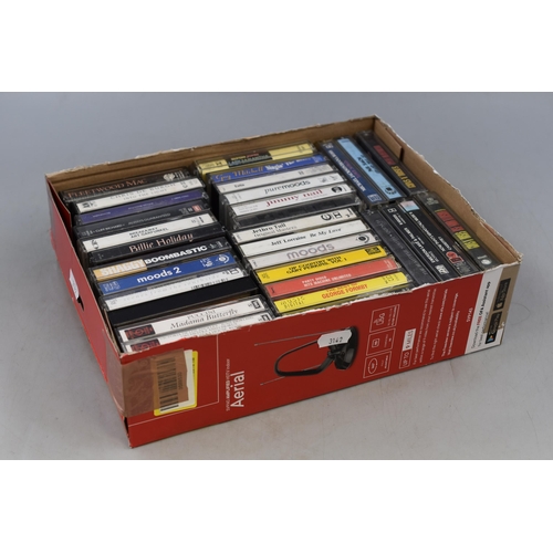 590 - A Selection of Cassettes To Include Guns n Roses, Fleetwood Mac, Paul Simon and More