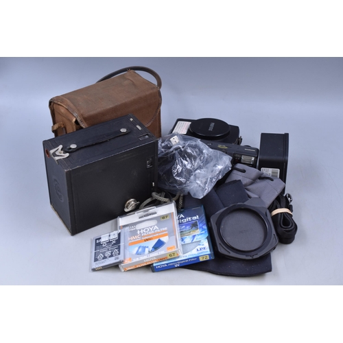 604 - A Selection of Camera Items To Include Filters, Brownie Box Camera, Gossen Profisix, And More