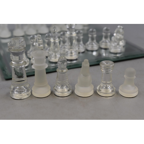 653 - A Complete Chess Set With Glass Pieces and Mirrored Board. Board is Approx 10