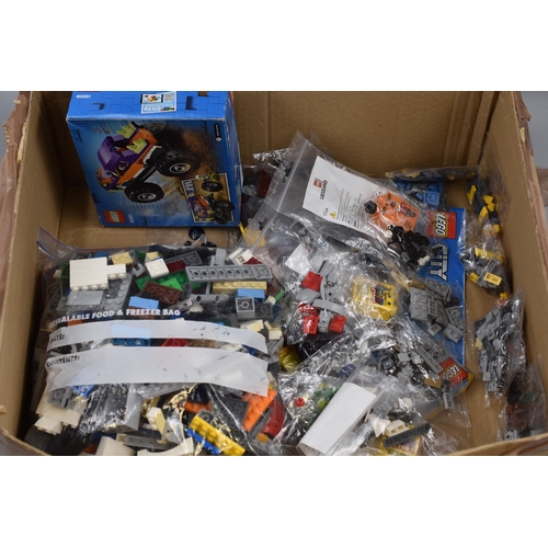 906 - A Box of Assorted Lego Pieces To Include Ducati Model (Unchecked), Lego City Set (Unchecked), And Mo... 