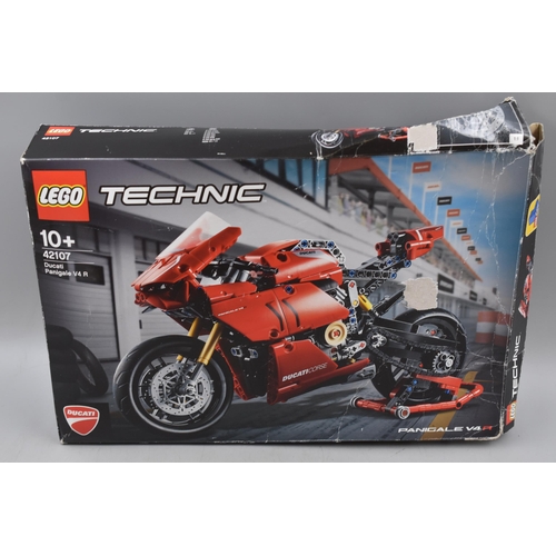 906 - A Box of Assorted Lego Pieces To Include Ducati Model (Unchecked), Lego City Set (Unchecked), And Mo... 