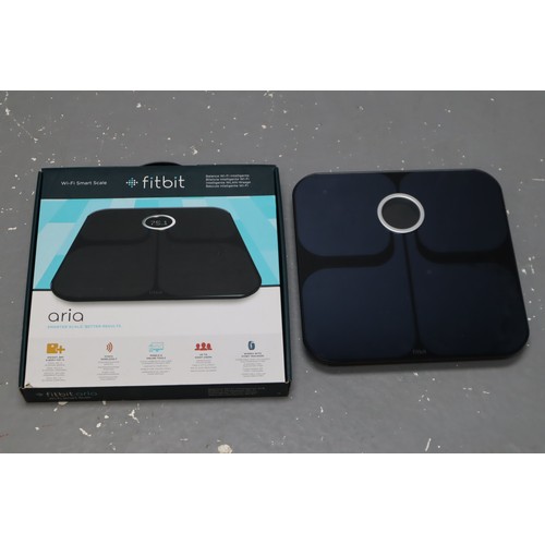 900 - A Boxed FitBit Wifi Smart Scale, Powers on When Tested