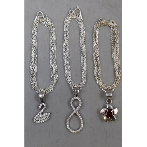 3 - Three Silver 925 Pendant Necklaces to include Swan Design, Flower with Red Stone and Infinity Design
