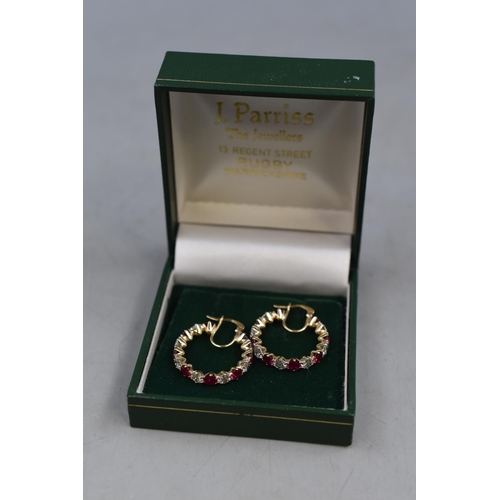 4 - Pair of Gold 375 (9ct) Clear and Ruby Stoned Hoop Earrings Complete with Presentation Box (5 grams)