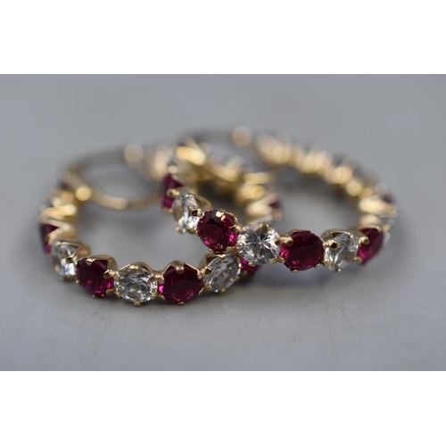 4 - Pair of Gold 375 (9ct) Clear and Ruby Stoned Hoop Earrings Complete with Presentation Box (5 grams)
