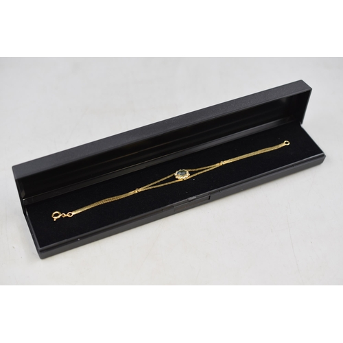5 - Gold 750 (18ct) Bracelet with Clear and Blue Stoned Center Complete with Presentation Box