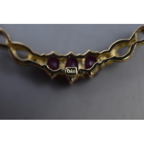 6 - Hallmarked 375 (9ct) Gold Clear and Ruby Stoned Necklace Complete with Presentation Box