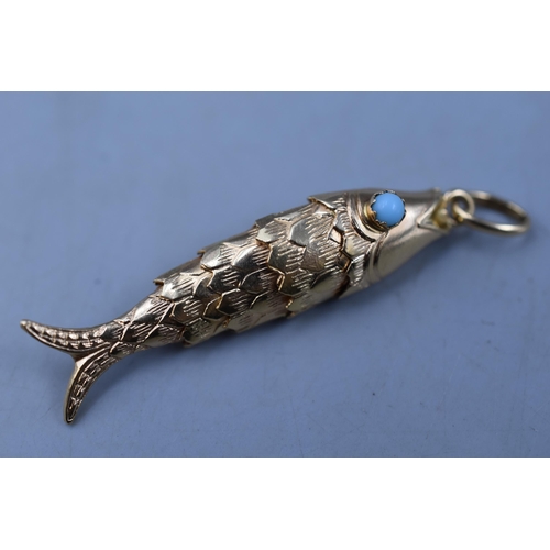 10 - Gold 750 (18ct) Articulated Fish Pendant with Turquoise stoned Eyes (2