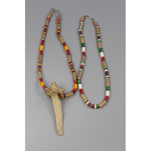 107 - Two Tribal Type Beaded Necklaces with Animal Bone Pendant