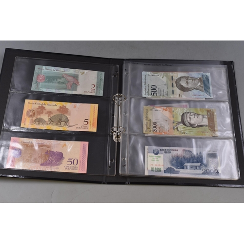 267 - Folder Containing a Selection of Uncirculated Worldwide Bank Notes. Includes Venezuela, Vietnam, Leb... 