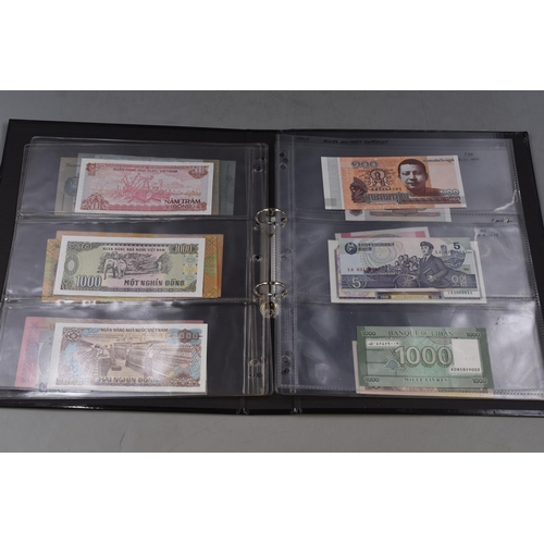 267 - Folder Containing a Selection of Uncirculated Worldwide Bank Notes. Includes Venezuela, Vietnam, Leb... 