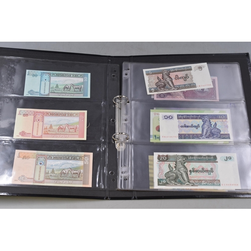 270 - Folder Containing a Large Selection of Uncirculated Worldwide Banknotes. Includes Ukraine, Mongolia,... 