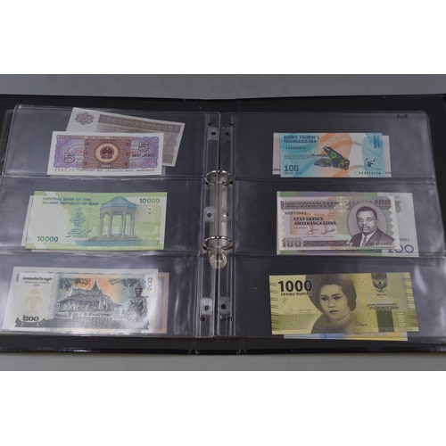 270 - Folder Containing a Large Selection of Uncirculated Worldwide Banknotes. Includes Ukraine, Mongolia,... 