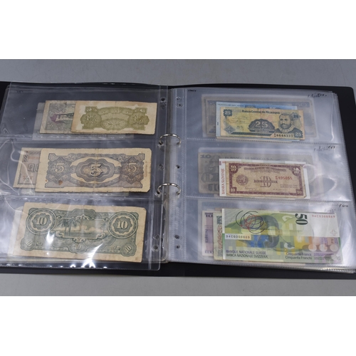 273 - Folder Containing a Selection of Old Worldwide Banknotes. Includes Pakistan, Cyprus, Saudi Arabia, E... 