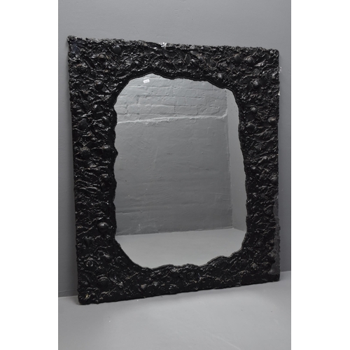 612 - Black gothic textured mirror measures 41