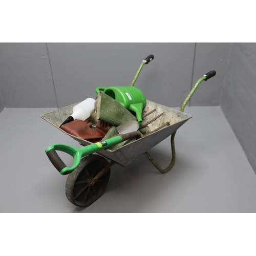 673 - Selection of Gardening equipment including Wheelbarrow, Wellies, Watering Can, Trowel and More