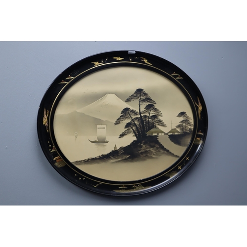 313 - Two oval Japanese chinoiserie style pictures of boating scenes with mount Fuji in black wood frames ... 